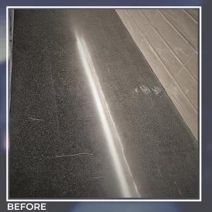 Corian countertop before polishing – visible scratches and dullness under kitchen lighting.
