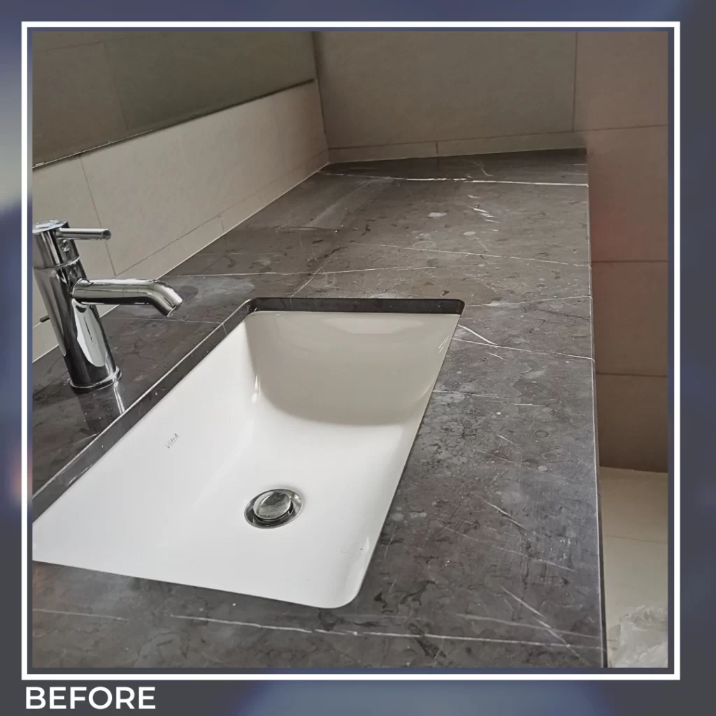 Marble kitchen countertop before professional polishing – etched, dull, and stained surface.