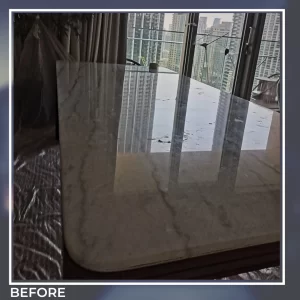 Marble tabletop before polishing – dull surface with stains and scratches in a dubai home.