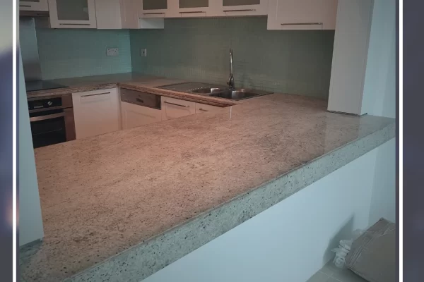 Granite countertop before restoration – faded color and visible surface damage in dubai kitchen.