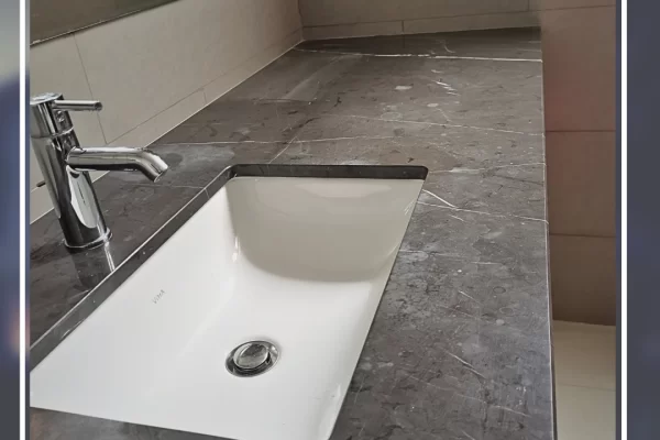 Marble kitchen countertop before professional polishing – etched, dull, and stained surface.